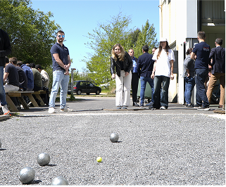 HyPrSpace team enjoying a casual pétanque game outside the workshop, highlighting the friendly and inclusive atmosphere at the company.